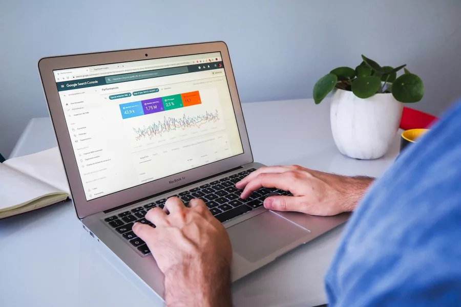 mans hands on laptop